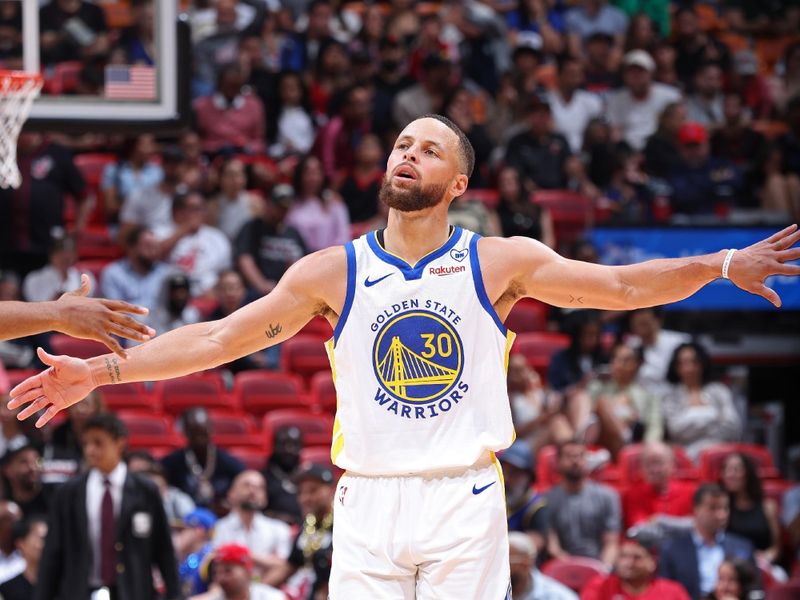 MIAMI, FL - MARCH 26:  Stephen Curry #30 of the Golden State Warriors looks on during the game against the Miami Heat on March 26, 2024 at Kaseya Center in Miami, Florida. NOTE TO USER: User expressly acknowledges and agrees that, by downloading and or using this Photograph, user is consenting to the terms and conditions of the Getty Images License Agreement. Mandatory Copyright Notice: Copyright 2024 NBAE (Photo by Jeff Haynes/NBAE via Getty Images)