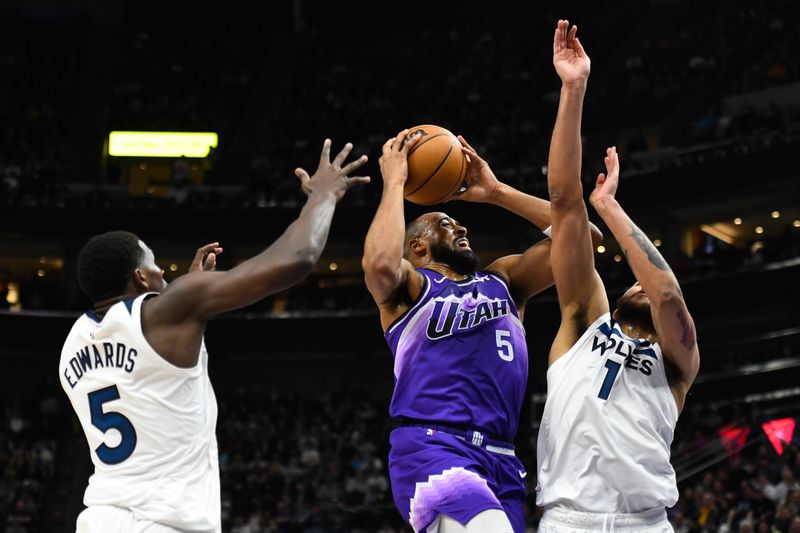 SALT LAKE CITY, UTAH - MARCH 18: Talen Horton-Tucker #5 of the Utah Jazz shoots over Kyle Anderson #1 of the Minnesota Timberwolves during the second half of a game at Delta Center on March 18, 2024 in Salt Lake City, Utah. NOTE TO USER: User expressly acknowledges and agrees that, by downloading and or using this photograph, User is consenting to the terms and conditions of the Getty Images License Agreement.  (Photo by Alex Goodlett/Getty Images)