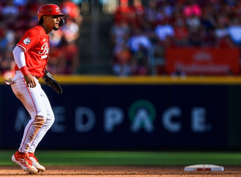 Sep 2, 2024; Cincinnati, Ohio, USA; Cincinnati Reds third baseman Santiago Espinal (4) leads off from second in the fifth inning against the Houston Astros at Great American Ball Park. Mandatory Credit: Katie Stratman-USA TODAY Sports