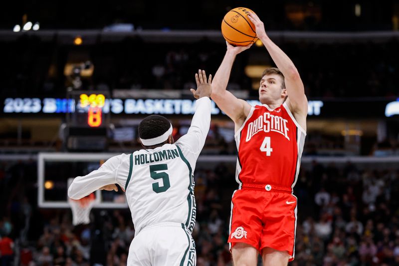 Mar 10, 2023; Chicago, IL, USA; Ohio State Buckeyes guard Sean McNeil (4) shoots against Michigan State Spartans guard Tre Holloman (5) during the first half at United Center. Mandatory Credit: Kamil Krzaczynski-USA TODAY Sports