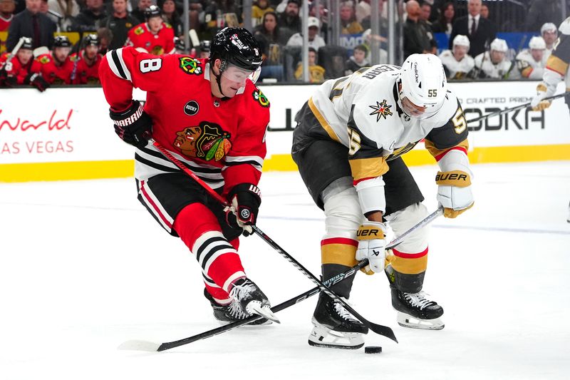 Oct 27, 2023; Las Vegas, Nevada, USA; Chicago Blackhawks center Ryan Donato (8) steals the puck from Vegas Golden Knights right wing Keegan Kolesar (55) during the third period at T-Mobile Arena. Mandatory Credit: Stephen R. Sylvanie-USA TODAY Sports