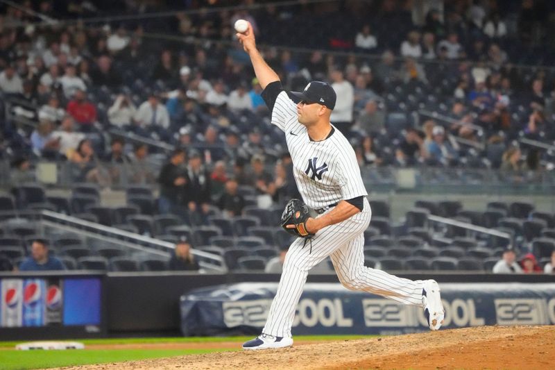 Jun 22, 2023; Bronx, New York, USA; New York Yankees pitcher Isiah Kiner-Falefa (12) delivers a pitch during the ninth inning against the Seattle Mariners at Yankee Stadium. Mandatory Credit: Gregory Fisher-USA TODAY Sports