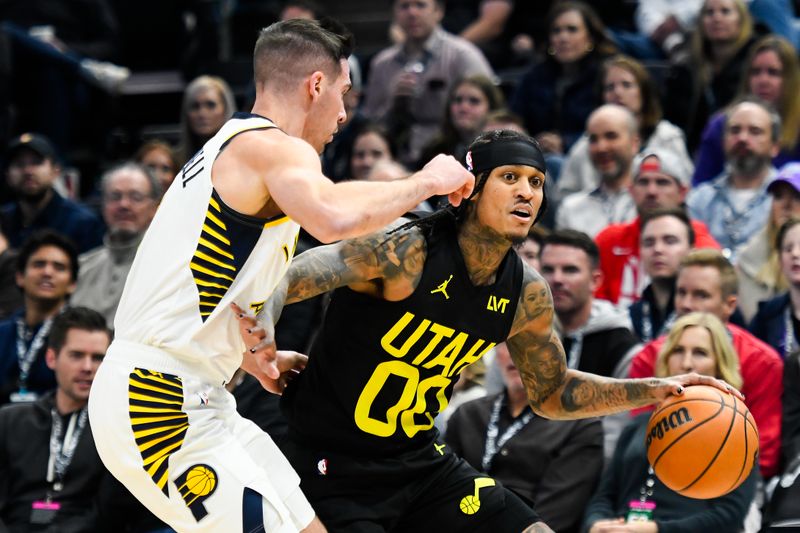 SALT LAKE CITY, UTAH - JANUARY 15: Jordan Clarkson #00 of the Utah Jazz drives against T.J. McConnell #9 of the Indiana Pacers during the first half of a game at Delta Center on January 15, 2024 in Salt Lake City, Utah. NOTE TO USER: User expressly acknowledges and agrees that, by downloading and or using this photograph, User is consenting to the terms and conditions of the Getty Images License Agreement. (Photo by Alex Goodlett/Getty Images)