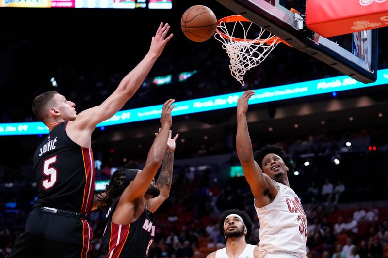 MIAMI, FLORIDA - MARCH 24: Isaac Okoro #35 of the Cleveland Cavaliers goes up for a shot against Nikola Jovic #5 of the Miami Heat during the first quarter at Kaseya Center on March 24, 2024 in Miami, Florida. NOTE TO USER: User expressly acknowledges and agrees that, by downloading and or using this photograph, User is consenting to the terms and conditions of the Getty Images License Agreement. (Photo by Rich Storry/Getty Images)