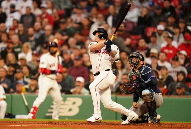 May 13, 2024; Boston, Massachusetts, USA; Boston Red Sox designated hitter Tyler O'Neill (17) hits a three run home run against the Tampa Bay Rays in the first inning at Fenway Park. Mandatory Credit: David Butler II-USA TODAY Sports