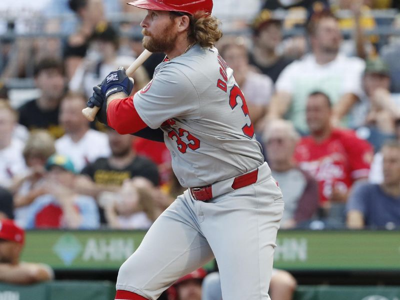 Jul 2, 2024; Pittsburgh, Pennsylvania, USA;  St. Louis Cardinals left fielder Brendan Donovan (33) hits a single against the Pittsburgh Pirates during the fourth inning at PNC Park. Mandatory Credit: Charles LeClaire-USA TODAY Sports