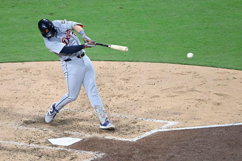 Sep 5, 2024; San Diego, California, USA; Detroit Tigers first baseman Spencer Torkelson (20) hits a single during the seventh inning against the San Diego Padres at Petco Park. Mandatory Credit: Denis Poroy-Imagn Images