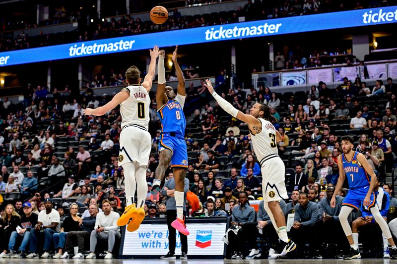 DENVER, COLORADO - OCTOBER 25: Jalen Williams #8 of the Oklahoma City Thunder shoots against Christian Braun #0 of the Denver Nuggets in the first half at Ball Arena on October 15, 2024 in Denver, Colorado. NOTE TO USER: User expressly acknowledges and agrees that, by downloading and or using this photograph, User is consenting to the terms and conditions of the Getty Images License Agreement. (Photo by Dustin Bradford/Getty Images)