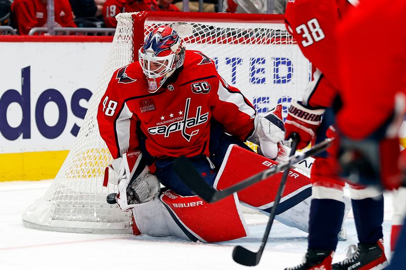 Mar 18, 2025; Washington, District of Columbia, USA; Washington Capitals goaltender Logan Thompson (48) makes a save during the second period against the Detroit Red Wings at Capital One Arena. Mandatory Credit: Peter Casey-Imagn Images