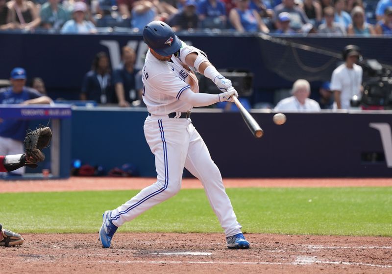 Jul 16, 2023; Toronto, Ontario, CAN; Toronto Blue Jays left fielder Whit Merrifield (15) hits a single against the Arizona Diamondbacks during the eighth inning at Rogers Centre. Mandatory Credit: Nick Turchiaro-USA TODAY Sports