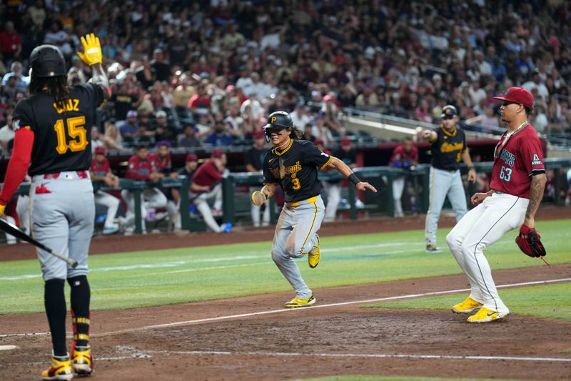 Jul 28, 2024; Phoenix, Arizona, USA; Pittsburgh Pirates outfielder Ji Hwan Bae (3) scores after Arizona Diamondbacks pitcher Justin Martinez (63) throws a wild pitch during the tenth inning at Chase Field. Mandatory Credit: Joe Camporeale-USA TODAY Sports