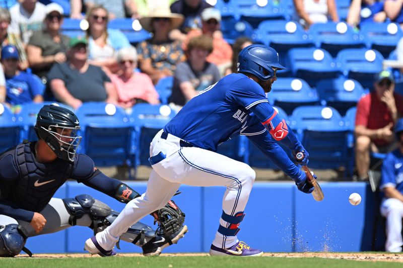 Mar 15, 2024; Dunedin, Florida, USA; Toronto Blue Jays centerfielder Kevin Kiermaier (39) attempts to bunt the ball in the first inning of a spring training game against the Detroit Tigers at TD Ballpark. Mandatory Credit: Jonathan Dyer-USA TODAY Sports