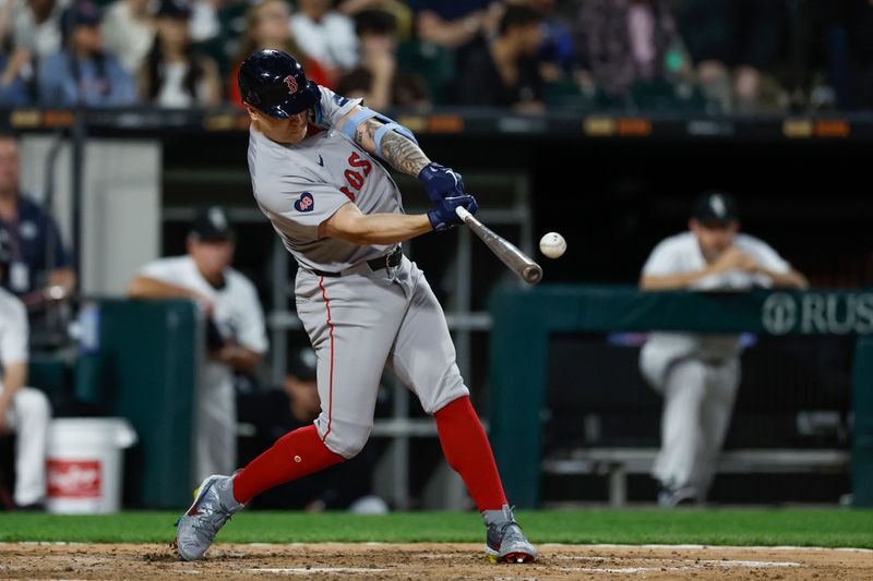 Jun 6, 2024; Chicago, Illinois, USA; Boston Red Sox outfielder Tyler O'Neill (17) hits a single against the Chicago White Sox during the sixth inning at Guaranteed Rate Field. Mandatory Credit: Kamil Krzaczynski-USA TODAY Sports