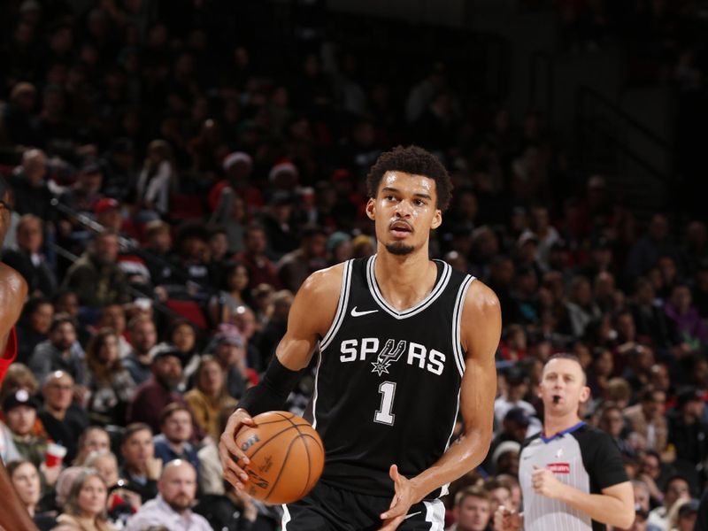 PORTLAND, OR - DECEMBER 13: Victor Wembanyama #1 of the San Antonio Spurs handles the ball during the game against the Portland Trail Blazers on December 13, 2024 at the Moda Center Arena in Portland, Oregon. NOTE TO USER: User expressly acknowledges and agrees that, by downloading and or using this photograph, user is consenting to the terms and conditions of the Getty Images License Agreement. Mandatory Copyright Notice: Copyright 2024 NBAE (Photo by Cameron Browne/NBAE via Getty Images)