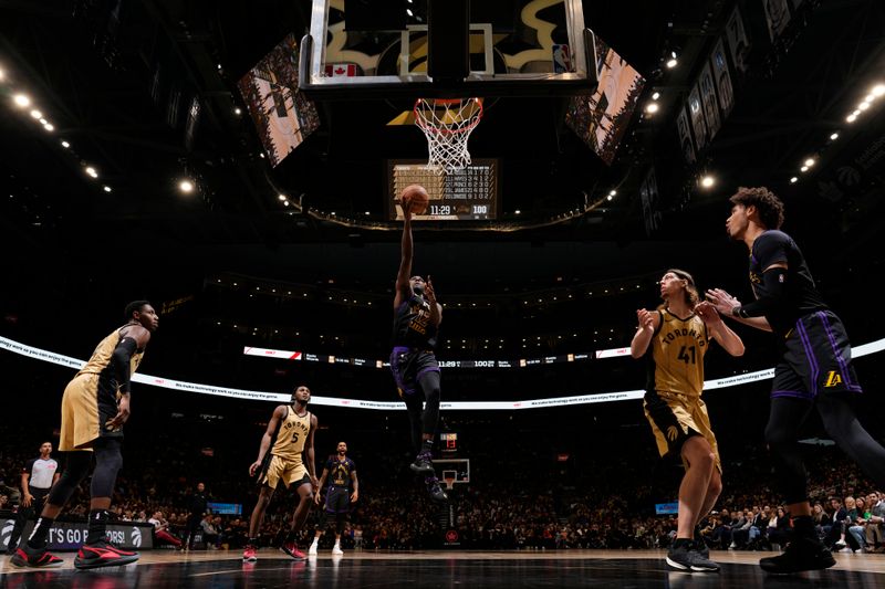 TORONTO, CANADA - APRIL 2: Taurean Prince #12 of the Los Angeles Lakers drives to the basket during the game against the Toronto Raptors on April 2, 2024 at the Scotiabank Arena in Toronto, Ontario, Canada.  NOTE TO USER: User expressly acknowledges and agrees that, by downloading and or using this Photograph, user is consenting to the terms and conditions of the Getty Images License Agreement.  Mandatory Copyright Notice: Copyright 2024 NBAE (Photo by Mark Blinch/NBAE via Getty Images)