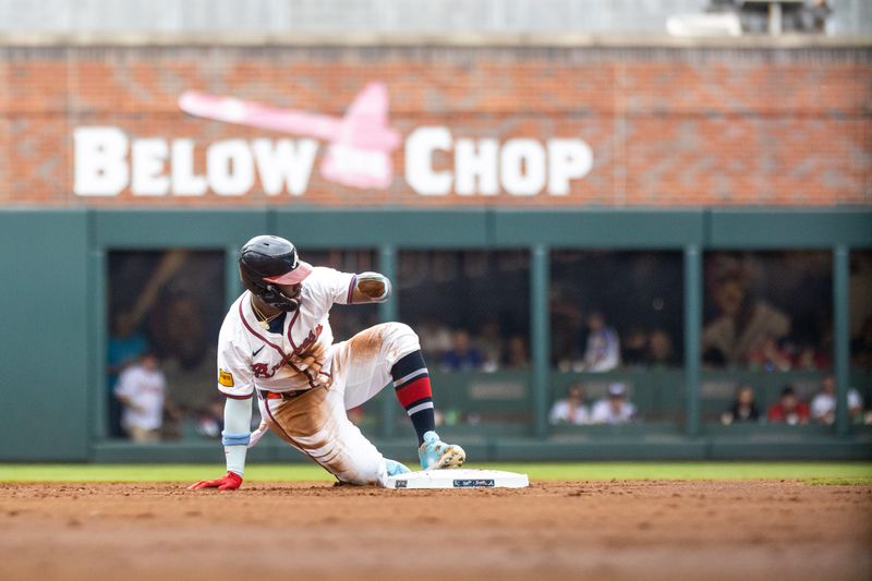 Sep 29, 2024; Cumberland, Georgia, USA; Atlanta Braves outfielder Michael Harris II (23) steals second base against the Kansas City Royals during the first inning at Truist Park. Mandatory Credit: Jordan Godfree-Imagn Images