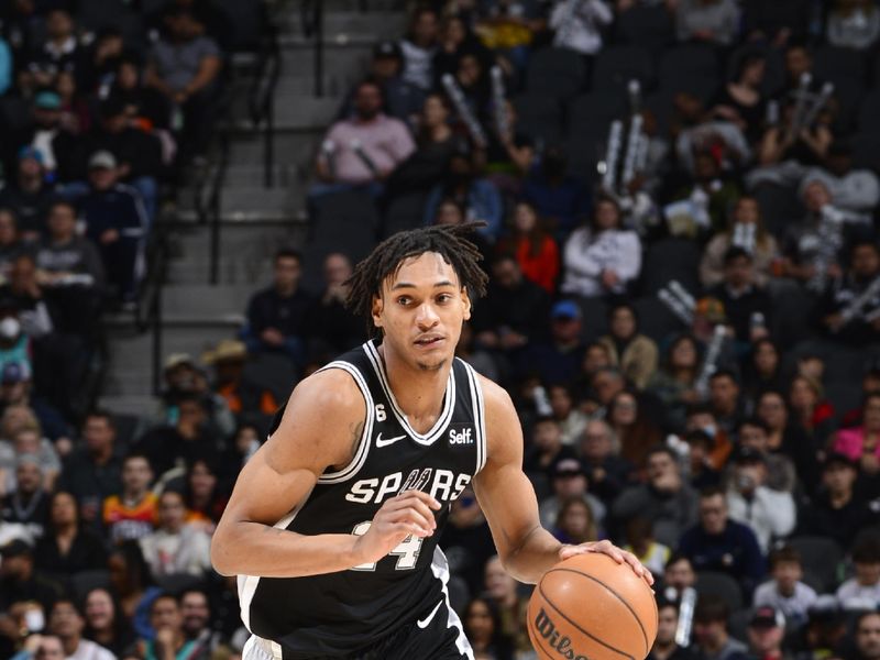 SAN ANTONIO, TX - DECEMBER 26: Devin Vassell #24 of the San Antonio Spurs drives to the basket against the Utah Jazz on December 26, 2022 at the AT&T Center in San Antonio, Texas. NOTE TO USER: User expressly acknowledges and agrees that, by downloading and or using this photograph, user is consenting to the terms and conditions of the Getty Images License Agreement. Mandatory Copyright Notice: Copyright 2022 NBAE (Photos by Michael Gonzales/NBAE via Getty Images)