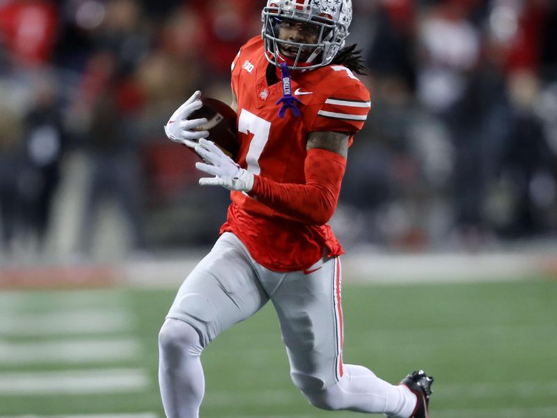 Nov 18, 2023; Columbus, Ohio, USA; Ohio State Buckeyes cornerback Jordan Hancock (7) runs after the interception during the second half against the Minnesota Golden Gophers at Ohio Stadium. Mandatory Credit: Joseph Maiorana-USA TODAY Sports