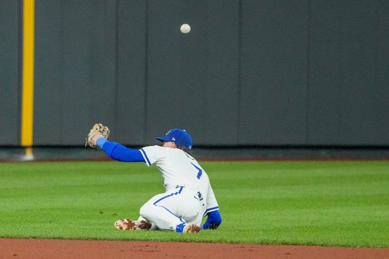 Aug 19, 2024; Kansas City, Missouri, USA; Kansas City Royals shortstop Bobby Witt Jr. (7) mis-plays a ground ball against the Los Angeles Angels in the ninth inning at Kauffman Stadium. Mandatory Credit: Denny Medley-USA TODAY Sports