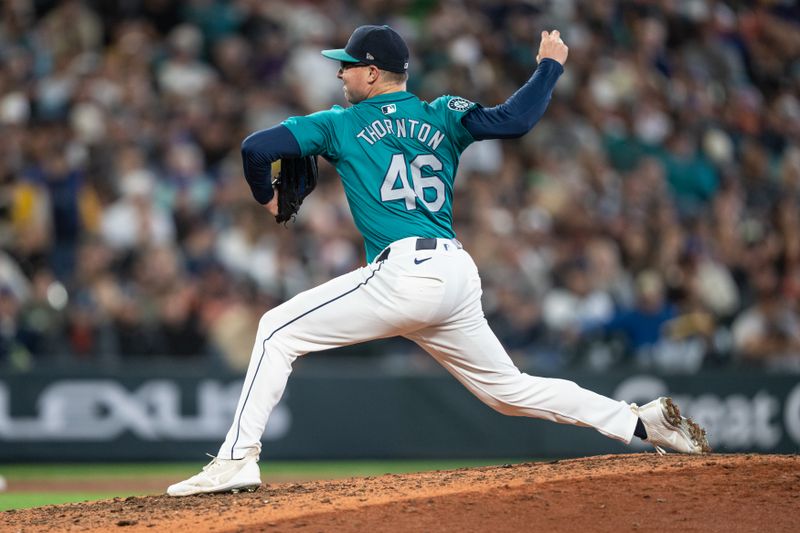 Aug 23, 2024; Seattle, Washington, USA; Seattle Mariners reliever Trent Thornton (46) delivers a pitch during the eighth inning against the San Francisco Giants at T-Mobile Park. Mandatory Credit: Stephen Brashear-USA TODAY Sports