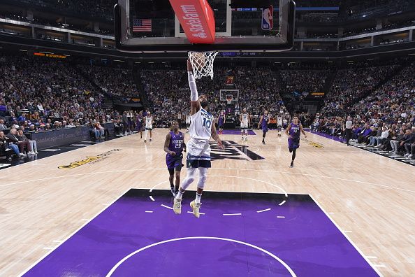 SACRAMENTO, CA - DECEMBER 23: Mike Conley #10 of the Minnesota Timberwolves drives to the basket during the game against the Sacramento Kings on December 23, 2023 at Golden 1 Center in Sacramento, California. NOTE TO USER: User expressly acknowledges and agrees that, by downloading and or using this Photograph, user is consenting to the terms and conditions of the Getty Images License Agreement. Mandatory Copyright Notice: Copyright 2023 NBAE (Photo by Rocky Widner/NBAE via Getty Images)