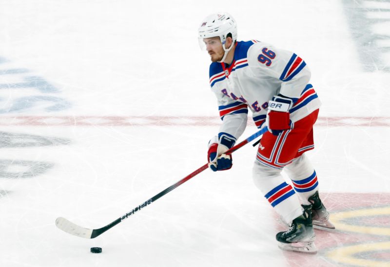 Mar 16, 2024; Pittsburgh, Pennsylvania, USA;  New York Rangers  center Jack Roslovic (96) moves the puck against the Pittsburgh Penguins during the third period at PPG Paints Arena. New York won 7-4. Mandatory Credit: Charles LeClaire-USA TODAY Sports