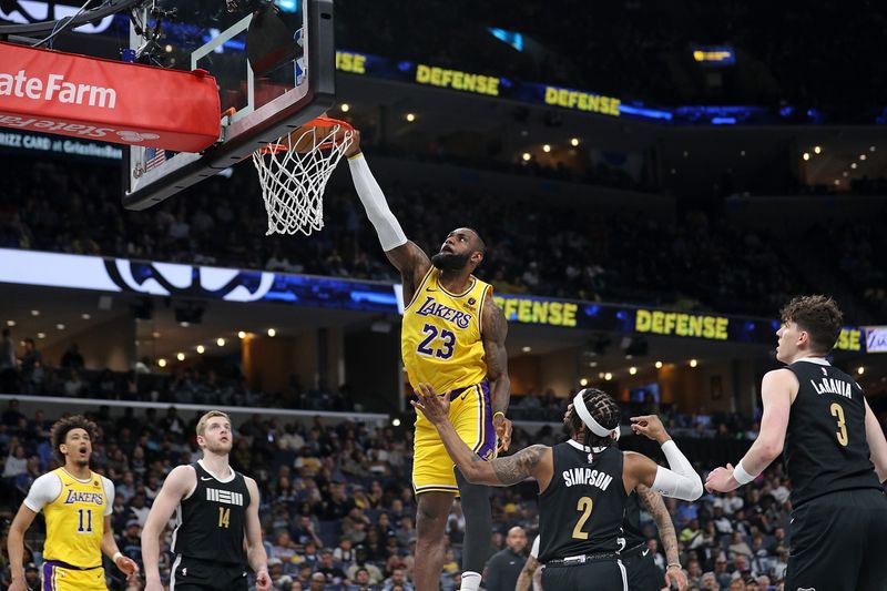 MEMPHIS, TENNESSEE - APRIL 12: LeBron James #23 of the Los Angeles Lakers goes to the basket during the game against Zavier Simpson #2 of the Memphis Grizzlies at FedExForum on April 12, 2024 in Memphis, Tennessee. NOTE TO USER: User expressly acknowledges and agrees that, by downloading and or using this photograph, User is consenting to the terms and conditions of the Getty Images License Agreement. (Photo by Justin Ford/Getty Images)