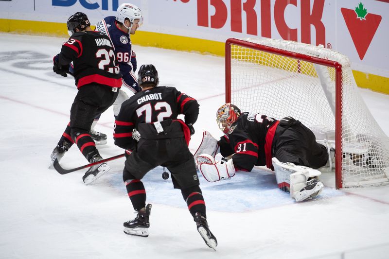 Feb 13, 2024; Ottawa, Ontario, CAN; Ottawa Senators goalie Anton Forsberg (31) makes a save in front of Columbus Blue Jackets center Jack Roslovic (96) in the third period at the Canadian Tire Centre. Mandatory Credit: Marc DesRosiers-USA TODAY Sports