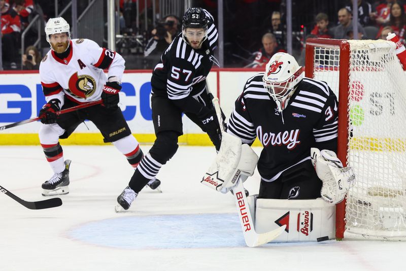 Mar 23, 2024; Newark, New Jersey, USA; New Jersey Devils goaltender Jake Allen (34) makes a save against the Ottawa Senators during the first period at Prudential Center. Mandatory Credit: Ed Mulholland-USA TODAY Sports