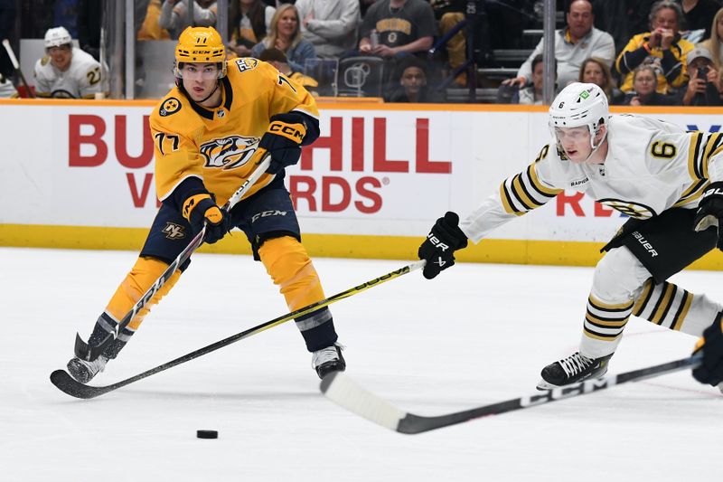 Apr 2, 2024; Nashville, Tennessee, USA; Nashville Predators right wing Luke Evangelista (77) passes the puck during the third period against the Boston Bruins at Bridgestone Arena. Mandatory Credit: Christopher Hanewinckel-USA TODAY Sports