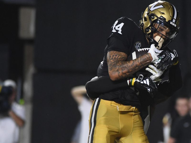 Aug 26, 2023; Nashville, Tennessee, USA; Vanderbilt Commodores wide receiver Will Sheppard (14) catches a touchdown pass during the second half against the Hawaii Warriors at FirstBank Stadium. Mandatory Credit: Christopher Hanewinckel-USA TODAY Sports