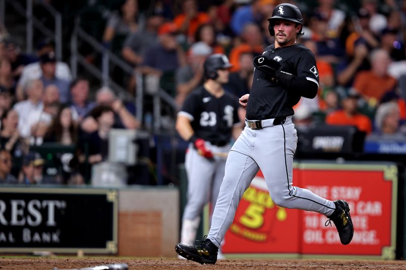 Aug 16, 2024; Houston, Texas, USA; Chicago White Sox right fielder Dominic Fletcher (7) crosses home plate to score a run against the Houston Astros during the eighth inning at Minute Maid Park. Mandatory Credit: Erik Williams-USA TODAY Sports