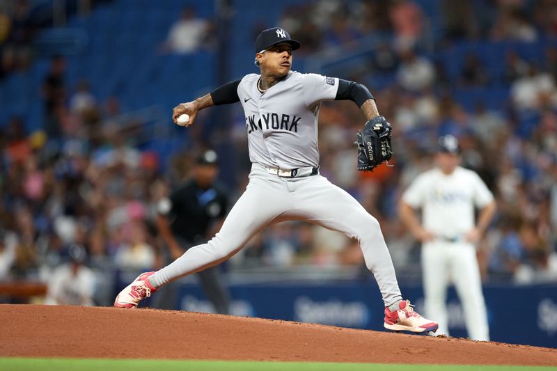 Jul 10, 2024; St. Petersburg, Florida, USA;  New York Yankees pitcher Marcus Stroman (0) throws a pitch against the Tampa Bay Rays in the first inning at Tropicana Field. Mandatory Credit: Nathan Ray Seebeck-USA TODAY Sports