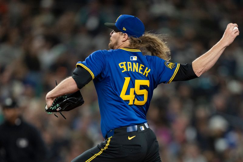 Jun 14, 2024; Seattle, Washington, USA; Seattle Mariners reliever Ryne Stanek (45) delivers a pitch during the ninth inning against the Texas Rangers at T-Mobile Park. Mandatory Credit: Stephen Brashear-USA TODAY Sports