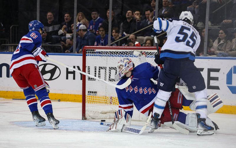 Mar 19, 2024; New York, New York, USA; Winnipeg Jets center Mark Scheifele (55) scores a goal on New York Rangers goalie Igor Shesterkin (31) during the second period at Madison Square Garden. Mandatory Credit: Danny Wild-USA TODAY Sports