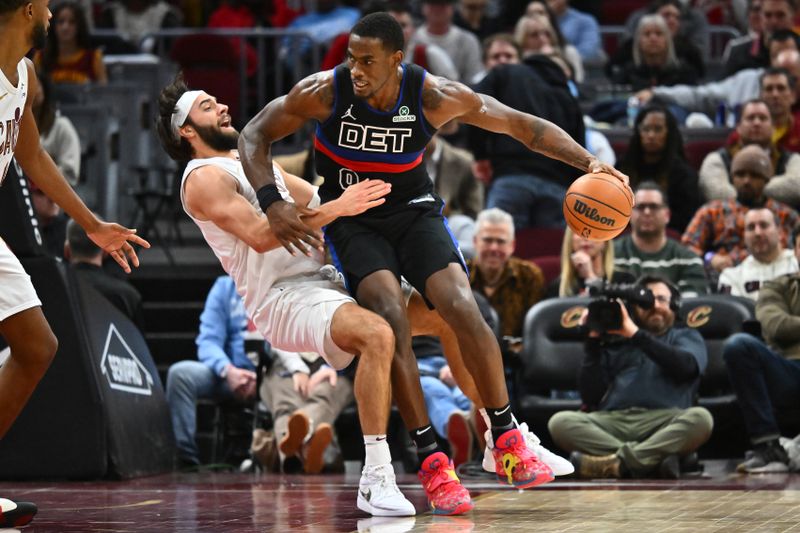 CLEVELAND, OHIO - JANUARY 27: Max Strus #1 of the Cleveland Cavaliers draw an offensive foul by Jalen Duren #0 of the Detroit Pistons during the fourth quarter at Rocket Mortgage Fieldhouse on January 27, 2025 in Cleveland, Ohio. The Cavaliers defeated the Pistons 110-91. NOTE TO USER: User expressly acknowledges and agrees that, by downloading and or using this photograph, User is consenting to the terms and conditions of the Getty Images License Agreement. (Photo by Jason Miller/Getty Images)