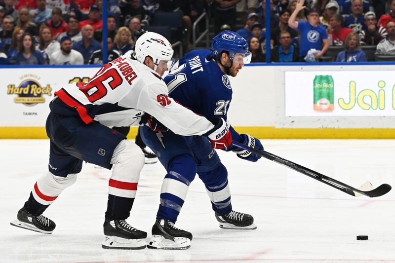 Mar 30, 2023; Tampa, Florida, USA; Tampa Bay Lightning center Brayden Point (21) attempts to get past Washington Capitals right wing Nicolas Aube-Kubel (96) in the third period at Amalie Arena. Mandatory Credit: Jonathan Dyer-USA TODAY Sports