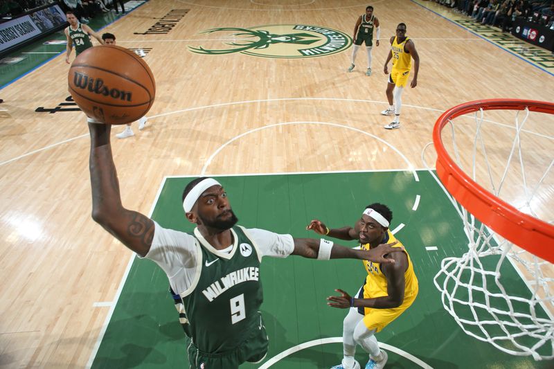 MILWAUKEE, WI - APRIL 21: Bobby Portis #9 of the Milwaukee Bucks dunks the ball during the game against the Indiana Pacers during Round 1 Game 1 of the 2024 NBA Playoffs on April 21, 2024 at the Fiserv Forum Center in Milwaukee, Wisconsin. NOTE TO USER: User expressly acknowledges and agrees that, by downloading and or using this Photograph, user is consenting to the terms and conditions of the Getty Images License Agreement. Mandatory Copyright Notice: Copyright 2024 NBAE (Photo by Gary Dineen/NBAE via Getty Images).