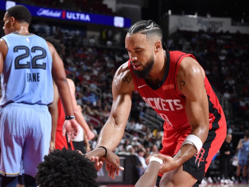 HOUSTON, TX - OCTOBER 25: Amen Thompson #1 and Dillon Brooks #9 of the Houston Rockets high five during the game against the Memphis Grizzlies on October 25, 2024 at the Toyota Center in Houston, Texas. NOTE TO USER: User expressly acknowledges and agrees that, by downloading and or using this photograph, User is consenting to the terms and conditions of the Getty Images License Agreement. Mandatory Copyright Notice: Copyright 2024 NBAE (Photo by Logan Riely/NBAE via Getty Images)