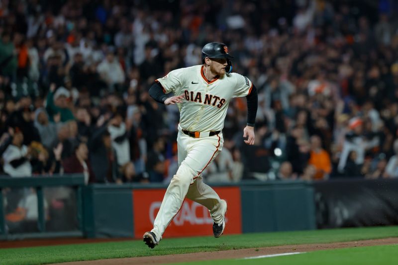May 19, 2025; San Francisco, California, USA;  San Francisco Giants catcher Sam Huff (23) scores a run on an rbi double by center fielder Jung Hoo Lee (51) during the eighth inning against the Kansas City Royals at Oracle Park. Mandatory Credit: Sergio Estrada-Imagn Images