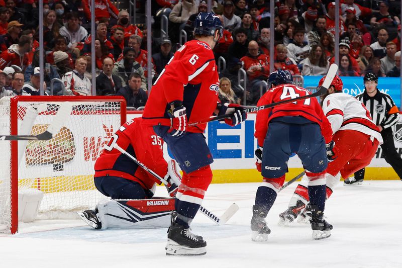 Jan 5, 2024; Washington, District of Columbia, USA; Carolina Hurricanes defenseman Brent Burns (8) scores a goal on Washington Capitals goaltender Darcy Kuemper (35) in the second period at Capital One Arena. Mandatory Credit: Geoff Burke-USA TODAY Sports