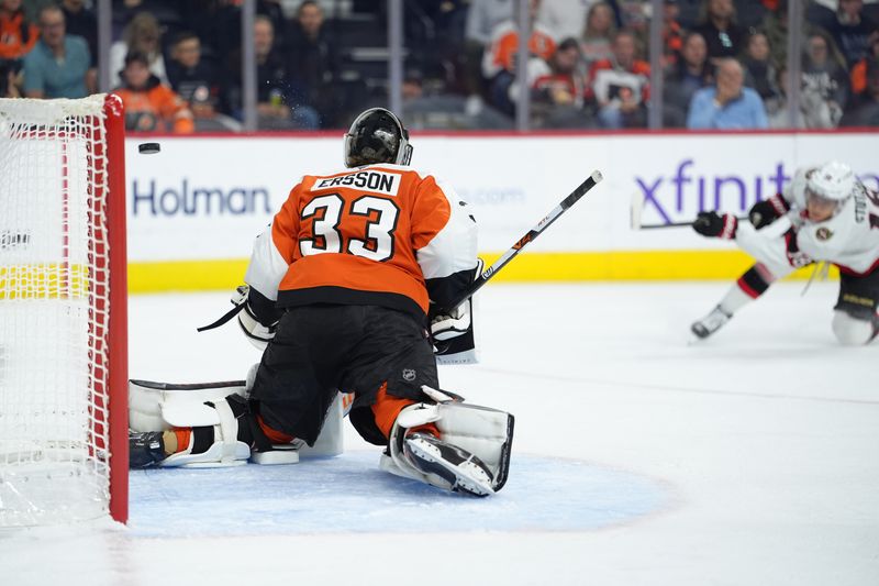 Nov 8, 2025; Philadelphia, Pennsylvania, USA; Philadelphia Flyers goalie Samuel Ersson (33) allows a goal against Ottawa Senators center Tim Stutzle (18) in the first period at Xfinity Mobile Arena. Mandatory Credit: Kyle Ross-Imagn Images