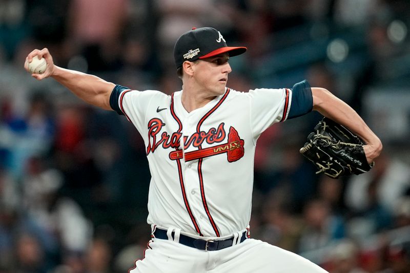 Oct 12, 2022; Atlanta, Georgia, USA; Atlanta Braves starting pitcher Kyle Wright (30) throws against the Philadelphia Phillies in the first inning during game two of the NLDS for the 2022 MLB Playoffs at Truist Park. Mandatory Credit: Dale Zanine-USA TODAY Sports