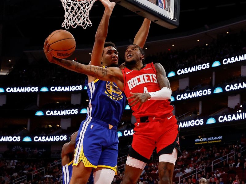 HOUSTON, TEXAS - NOVEMBER 02: Jalen Green #4 of the Houston Rockets goes up for a shot against Trayce Jackson-Davis #32 of the Golden State Warriors in the first half at Toyota Center on November 02, 2024 in Houston, Texas.  NOTE TO USER: User expressly acknowledges and agrees that, by downloading and or using this photograph, User is consenting to the terms and conditions of the Getty Images License Agreement.  (Photo by Tim Warner/Getty Images)