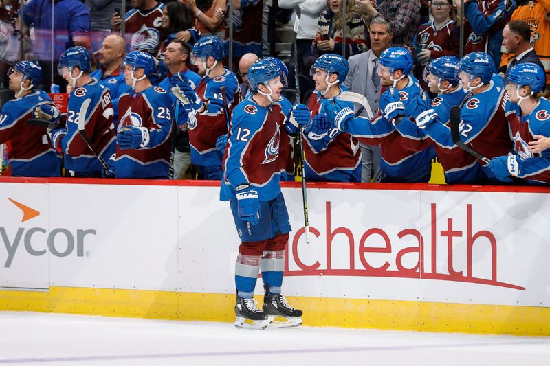 Oct 19, 2023; Denver, Colorado, USA; Colorado Avalanche center Ryan Johansen (12) celebrates with the bench after his goal in the first period against the Chicago Blackhawks at Ball Arena. Mandatory Credit: Isaiah J. Downing-USA TODAY Sports