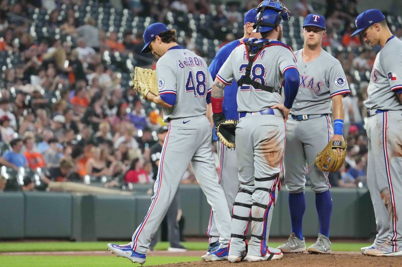 Jun 25, 2025; Baltimore, Maryland, USA; Texas Rangers pitcher Jason deGrom (48) exits the game in the eighth inning against the Baltimore Orioles at Oriole Park at Camden Yards. Mandatory Credit: Mitch Stringer-Imagn Images