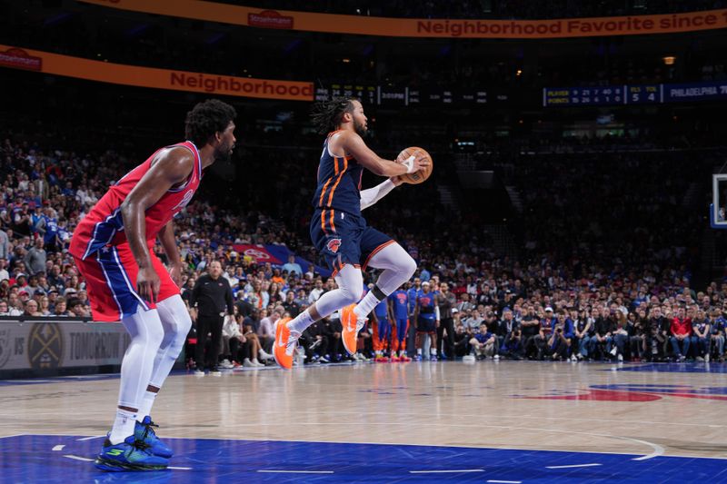 PHILADELPHIA, PA - APRIL 28: Jalen Brunson #11 of the New York Knicks passes the ball during the game against the Philadelphia 76ers during Round 1 Game 4 of the 2024 NBA Playoffs on April 28, 2024 at the Wells Fargo Center in Philadelphia, Pennsylvania NOTE TO USER: User expressly acknowledges and agrees that, by downloading and/or using this Photograph, user is consenting to the terms and conditions of the Getty Images License Agreement. Mandatory Copyright Notice: Copyright 2024 NBAE (Photo by Jesse D. Garrabrant/NBAE via Getty Images)