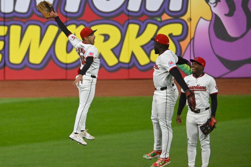 Apr 30, 2025; Cleveland, Ohio, USA; Cleveland Guardians left fielder Steven Kwan (38), right fielder Jhonkensy Noel (43) and center fielder Angel Martinez (1) celebrate a win over the Minnesota Twins at Progressive Field. Mandatory Credit: David Richard-Imagn Images