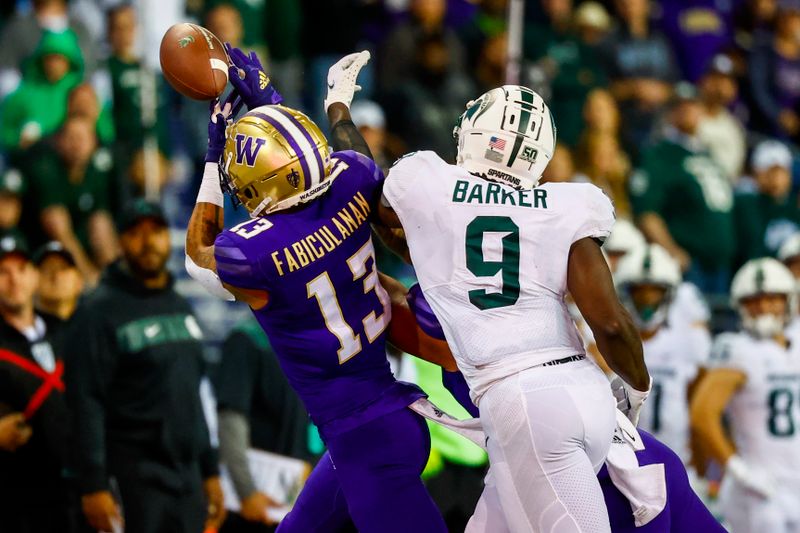 Sep 17, 2022; Seattle, Washington, USA; Washington Huskies linebacker Kamren Fabiculanan (13) defends a pass against Michigan State Spartans tight end Daniel Barker (9) during the fourth quarter at Alaska Airlines Field at Husky Stadium. Mandatory Credit: Joe Nicholson-USA TODAY Sports