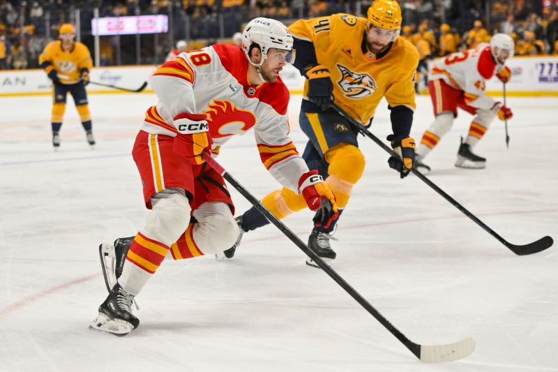 Dec 2, 2025; Nashville, Tennessee, USA;  Calgary Flames center John Beecher (18) skates with the puck against the Nashville Predators during the second period at Bridgestone Arena. Mandatory Credit: Steve Roberts-Imagn Images